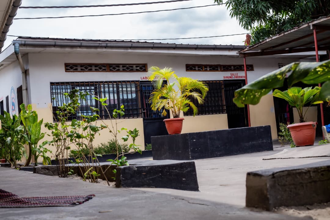 Courtyard of the clinic with signs for laboratory and observation rooms